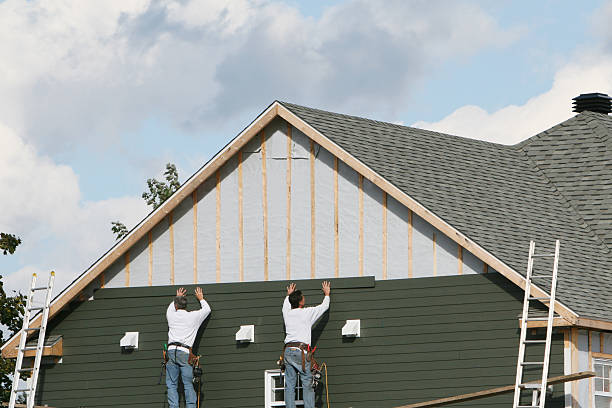 Professional Siding technician working in Windsor, CO
